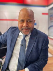 Jeff Pegues sitting at a news desk