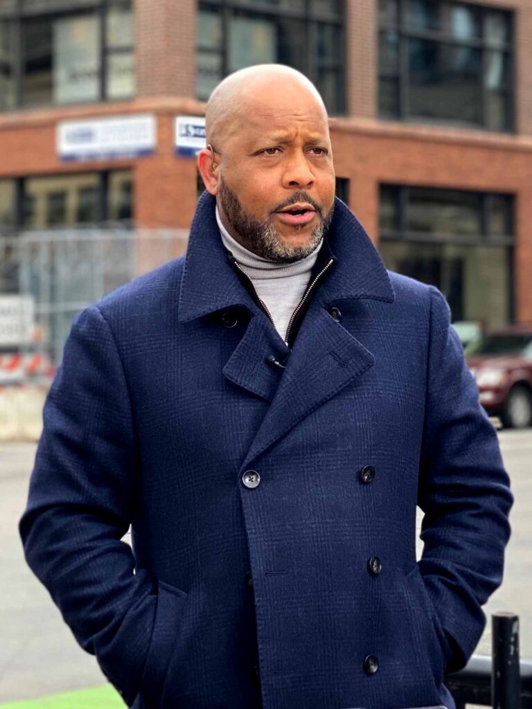 Jeff Pegues on camera on a street